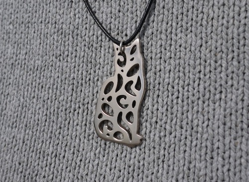 Lovely harlequin cat pendant made by Jolyon Yates at ODE